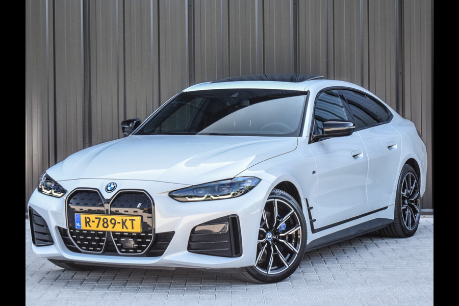 BMW i4 eDrive40 High EXECUTIVE 84 kWh | M-SPORT | SCHUIFDAK | SHADOW-LINE | NL- AUTO | CAMERA | HEAD-UP | TREKHAAK | MEMORY SEATS | AMB