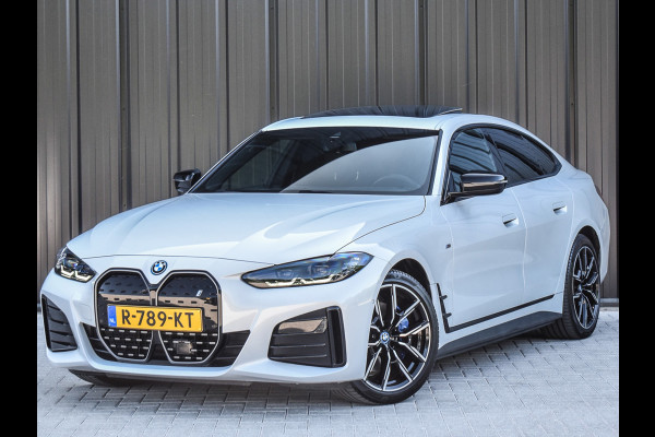 BMW i4 eDrive40 High EXECUTIVE 84 kWh | M-SPORT | SCHUIFDAK | SHADOW-LINE | NL- AUTO | CAMERA | HEAD-UP | TREKHAAK | MEMORY SEATS | AMB