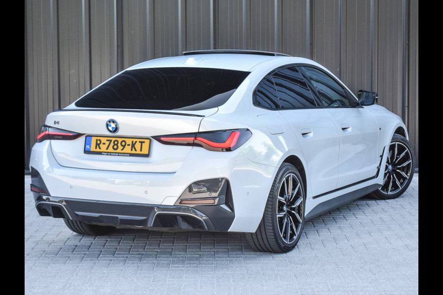 BMW i4 eDrive40 High EXECUTIVE 84 kWh | M-SPORT | SCHUIFDAK | SHADOW-LINE | NL- AUTO | CAMERA | HEAD-UP | TREKHAAK | MEMORY SEATS | AMB