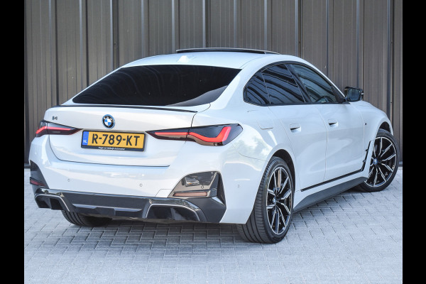 BMW i4 eDrive40 High EXECUTIVE 84 kWh | M-SPORT | SCHUIFDAK | SHADOW-LINE | NL- AUTO | CAMERA | HEAD-UP | TREKHAAK | MEMORY SEATS | AMB