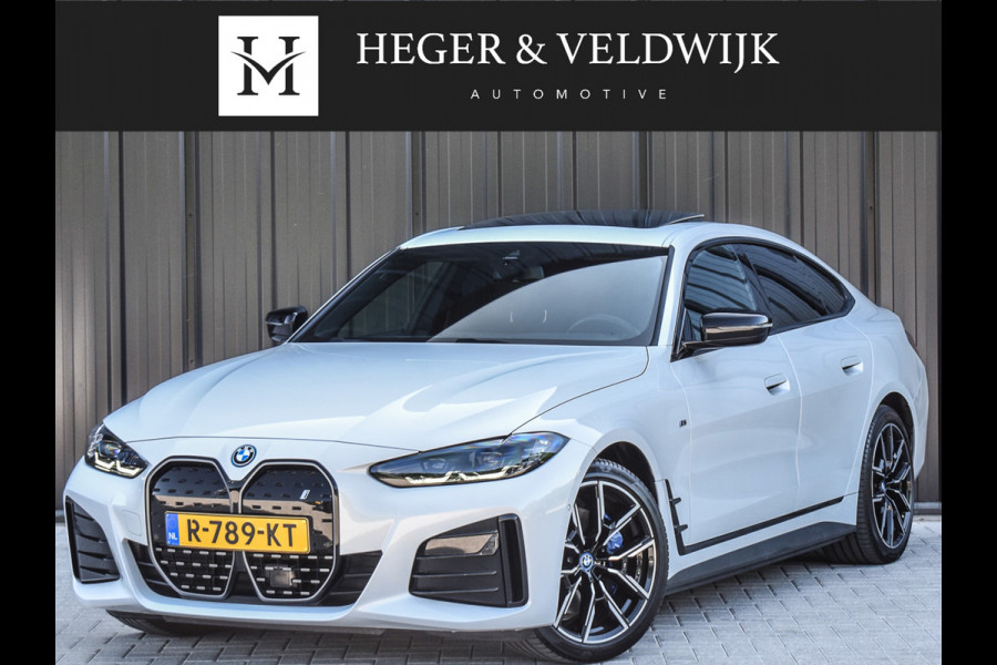 BMW i4 eDrive40 High EXECUTIVE 84 kWh | M-SPORT | SCHUIFDAK | SHADOW-LINE | NL- AUTO | CAMERA | HEAD-UP | TREKHAAK | MEMORY SEATS | AMB