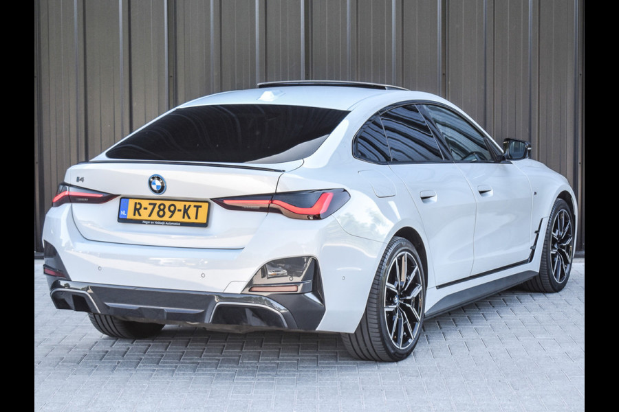 BMW i4 eDrive40 High EXECUTIVE 84 kWh | M-SPORT | SCHUIFDAK | SHADOW-LINE | NL- AUTO | CAMERA | HEAD-UP | TREKHAAK | MEMORY SEATS | AMB