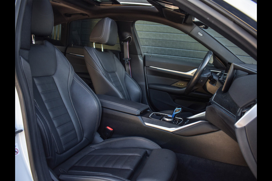 BMW i4 eDrive40 High EXECUTIVE 84 kWh | M-SPORT | SCHUIFDAK | SHADOW-LINE | NL- AUTO | CAMERA | HEAD-UP | TREKHAAK | MEMORY SEATS | AMB