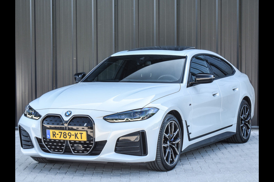 BMW i4 eDrive40 High EXECUTIVE 84 kWh | M-SPORT | SCHUIFDAK | SHADOW-LINE | NL- AUTO | CAMERA | HEAD-UP | TREKHAAK | MEMORY SEATS | AMB