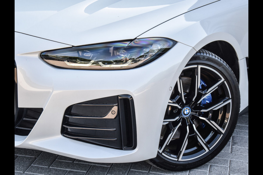 BMW i4 eDrive40 High EXECUTIVE 84 kWh | M-SPORT | SCHUIFDAK | SHADOW-LINE | NL- AUTO | CAMERA | HEAD-UP | TREKHAAK | MEMORY SEATS | AMB