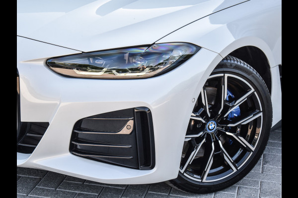BMW i4 eDrive40 High EXECUTIVE 84 kWh | M-SPORT | SCHUIFDAK | SHADOW-LINE | NL- AUTO | CAMERA | HEAD-UP | TREKHAAK | MEMORY SEATS | AMB