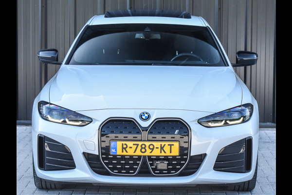 BMW i4 eDrive40 High EXECUTIVE 84 kWh | M-SPORT | SCHUIFDAK | SHADOW-LINE | NL- AUTO | CAMERA | HEAD-UP | TREKHAAK | MEMORY SEATS | AMB