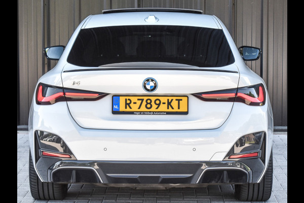 BMW i4 eDrive40 High EXECUTIVE 84 kWh | M-SPORT | SCHUIFDAK | SHADOW-LINE | NL- AUTO | CAMERA | HEAD-UP | TREKHAAK | MEMORY SEATS | AMB