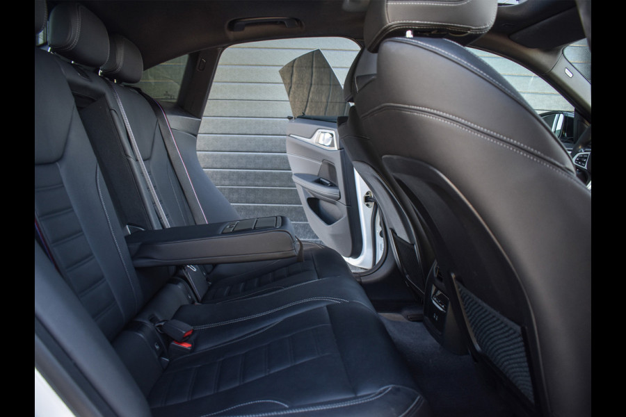 BMW i4 eDrive40 High EXECUTIVE 84 kWh | M-SPORT | SCHUIFDAK | SHADOW-LINE | NL- AUTO | CAMERA | HEAD-UP | TREKHAAK | MEMORY SEATS | AMB