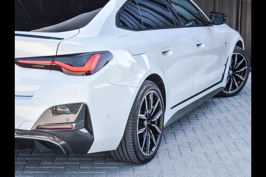 BMW i4 eDrive40 High EXECUTIVE 84 kWh | M-SPORT | SCHUIFDAK | SHADOW-LINE | NL- AUTO | CAMERA | HEAD-UP | TREKHAAK | MEMORY SEATS | AMB