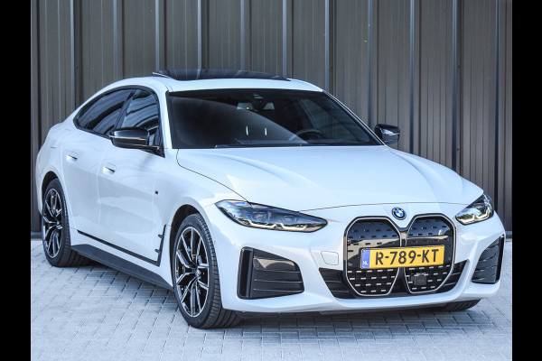 BMW i4 eDrive40 High EXECUTIVE 84 kWh | M-SPORT | SCHUIFDAK | SHADOW-LINE | NL- AUTO | CAMERA | HEAD-UP | TREKHAAK | MEMORY SEATS | AMB