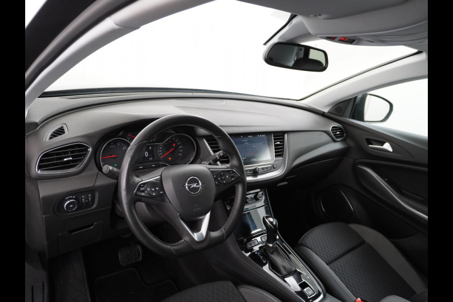 Opel Grandland X T131PK Autom. AGR-Comfort Stoelen Apple Carplay Android Auto Navi Ecc Elek.Achterklep Stuur/Stoelverwarming Cruise Control Pdc K Regen/Lichtsensor Dodehoeksensor Rijstrooksensor Verkeersbordlezer Winterpakket DAB+ Lmv 18" 1.2 Turbo 1e Eigenaar
