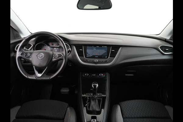 Opel Grandland X T131PK Autom. AGR-Comfort Stoelen Apple Carplay Android Auto Navi Ecc Elek.Achterklep Stuur/Stoelverwarming Cruise Control Pdc K Regen/Lichtsensor Dodehoeksensor Rijstrooksensor Verkeersbordlezer Winterpakket DAB+ Lmv 18" 1.2 Turbo 1e Eigenaar