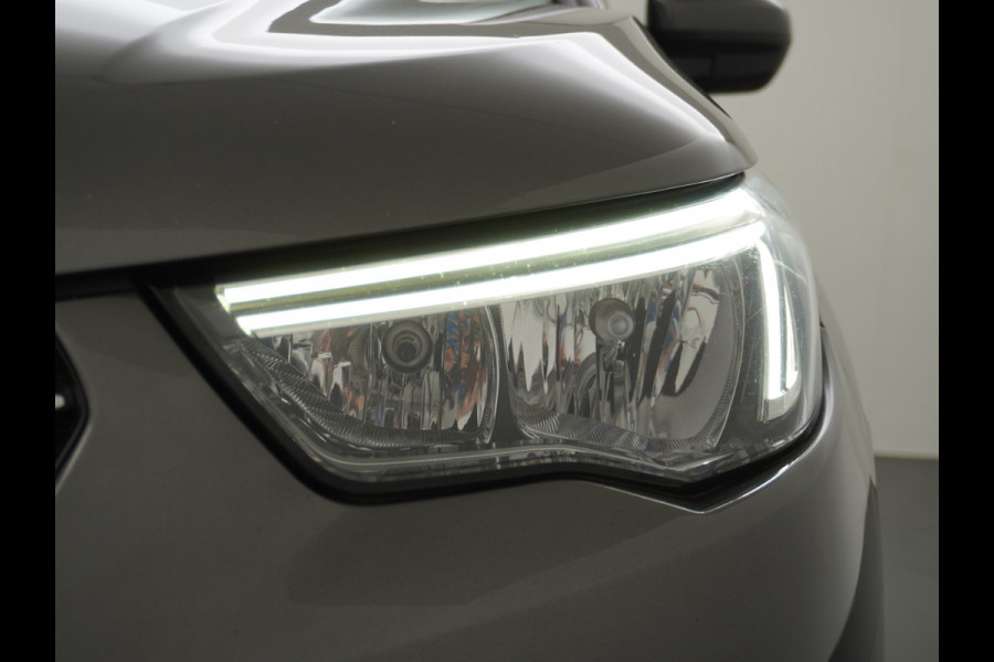 Opel Grandland X T131PK Autom. AGR-Comfort Stoelen Apple Carplay Android Auto Navi Ecc Elek.Achterklep Stuur/Stoelverwarming Cruise Control Pdc K Regen/Lichtsensor Dodehoeksensor Rijstrooksensor Verkeersbordlezer Winterpakket DAB+ Lmv 18" 1.2 Turbo 1e Eigenaar