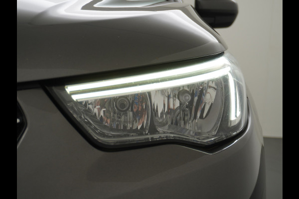 Opel Grandland X T131PK Autom. AGR-Comfort Stoelen Apple Carplay Android Auto Navi Ecc Elek.Achterklep Stuur/Stoelverwarming Cruise Control Pdc K Regen/Lichtsensor Dodehoeksensor Rijstrooksensor Verkeersbordlezer Winterpakket DAB+ Lmv 18" 1.2 Turbo 1e Eigenaar