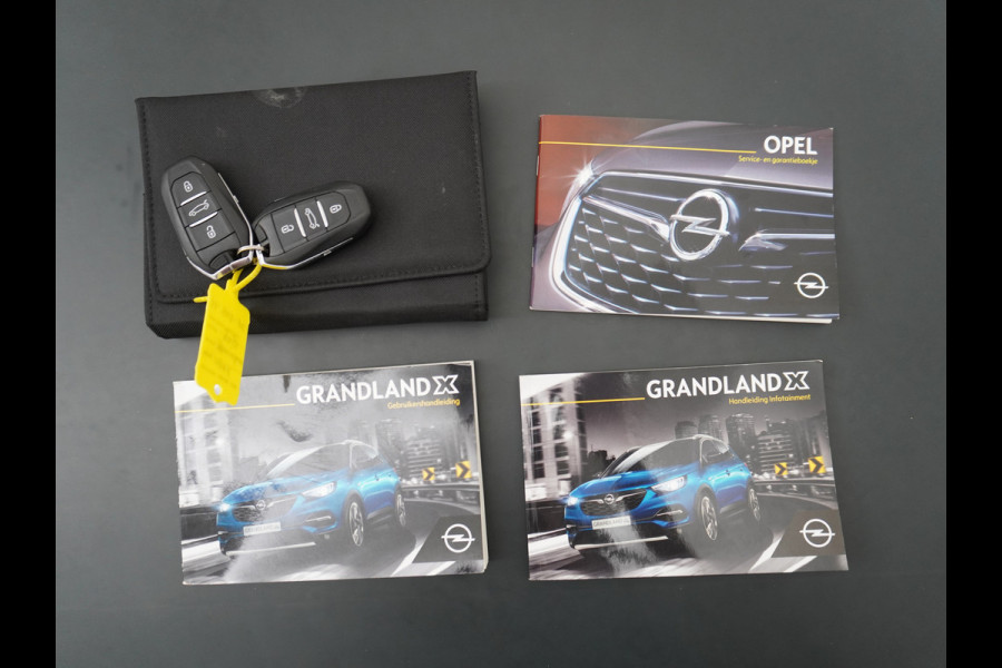Opel Grandland X T131PK Autom. AGR-Comfort Stoelen Apple Carplay Android Auto Navi Ecc Elek.Achterklep Stuur/Stoelverwarming Cruise Control Pdc K Regen/Lichtsensor Dodehoeksensor Rijstrooksensor Verkeersbordlezer Winterpakket DAB+ Lmv 18" 1.2 Turbo 1e Eigenaar