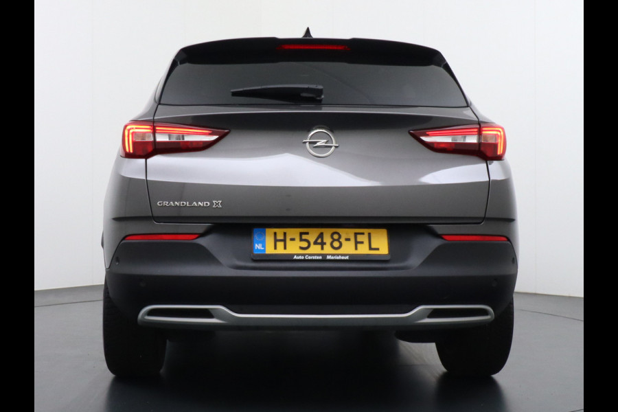 Opel Grandland X T131PK Autom. AGR-Comfort Stoelen Apple Carplay Android Auto Navi Ecc Elek.Achterklep Stuur/Stoelverwarming Cruise Control Pdc K Regen/Lichtsensor Dodehoeksensor Rijstrooksensor Verkeersbordlezer Winterpakket DAB+ Lmv 18" 1.2 Turbo 1e Eigenaar