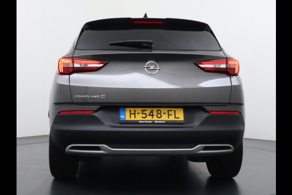 Opel Grandland X T131PK Autom. AGR-Comfort Stoelen Apple Carplay Android Auto Navi Ecc Elek.Achterklep Stuur/Stoelverwarming Cruise Control Pdc K Regen/Lichtsensor Dodehoeksensor Rijstrooksensor Verkeersbordlezer Winterpakket DAB+ Lmv 18" 1.2 Turbo 1e Eigenaar