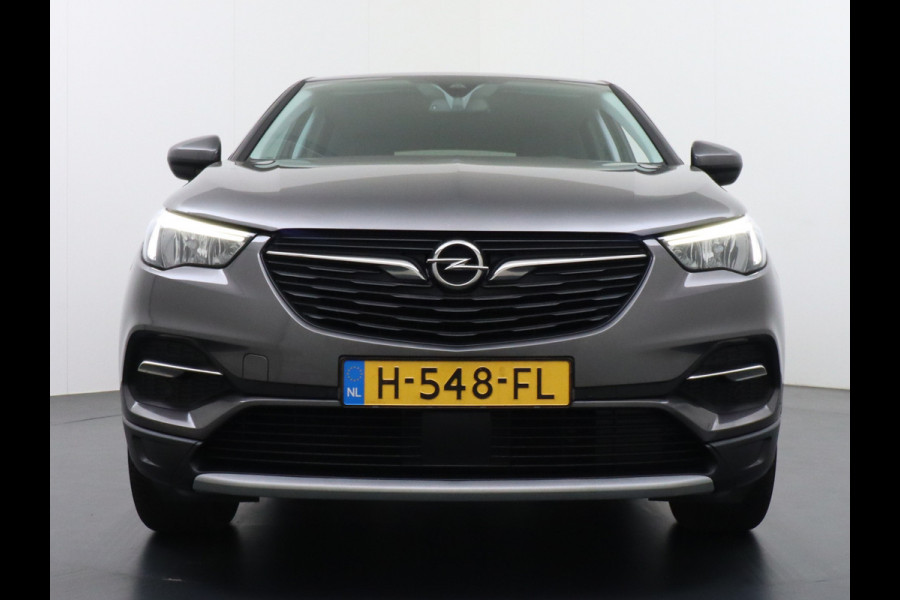 Opel Grandland X T131PK Autom. AGR-Comfort Stoelen Apple Carplay Android Auto Navi Ecc Elek.Achterklep Stuur/Stoelverwarming Cruise Control Pdc K Regen/Lichtsensor Dodehoeksensor Rijstrooksensor Verkeersbordlezer Winterpakket DAB+ Lmv 18" 1.2 Turbo 1e Eigenaar