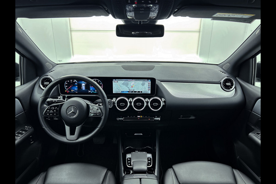 Mercedes-Benz B-Klasse 180 Business Solution | Achteruitrijcamera | Lichtmetalen velgen | Navigatie | Parking support | Trekhaak | Electrisch achterklep Inclusief 24 maanden MB Certified garantie voor Europa.
