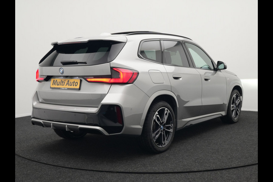 BMW X1 xDrive30e M Sport Plug In Hybrid 326pk PHEV | Trekhaak af Fabriek | Panodak | Adaptive Cruise | Widescreen Navi | 360 Camera | Alcantara Sportstoelen Massage & Memory | Harman Kardon |