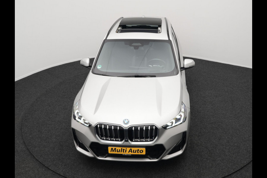 BMW X1 xDrive30e M Sport Plug In Hybrid 326pk PHEV | Trekhaak af Fabriek | Panodak | Adaptive Cruise | Widescreen Navi | 360 Camera | Alcantara Sportstoelen Massage & Memory | Harman Kardon |