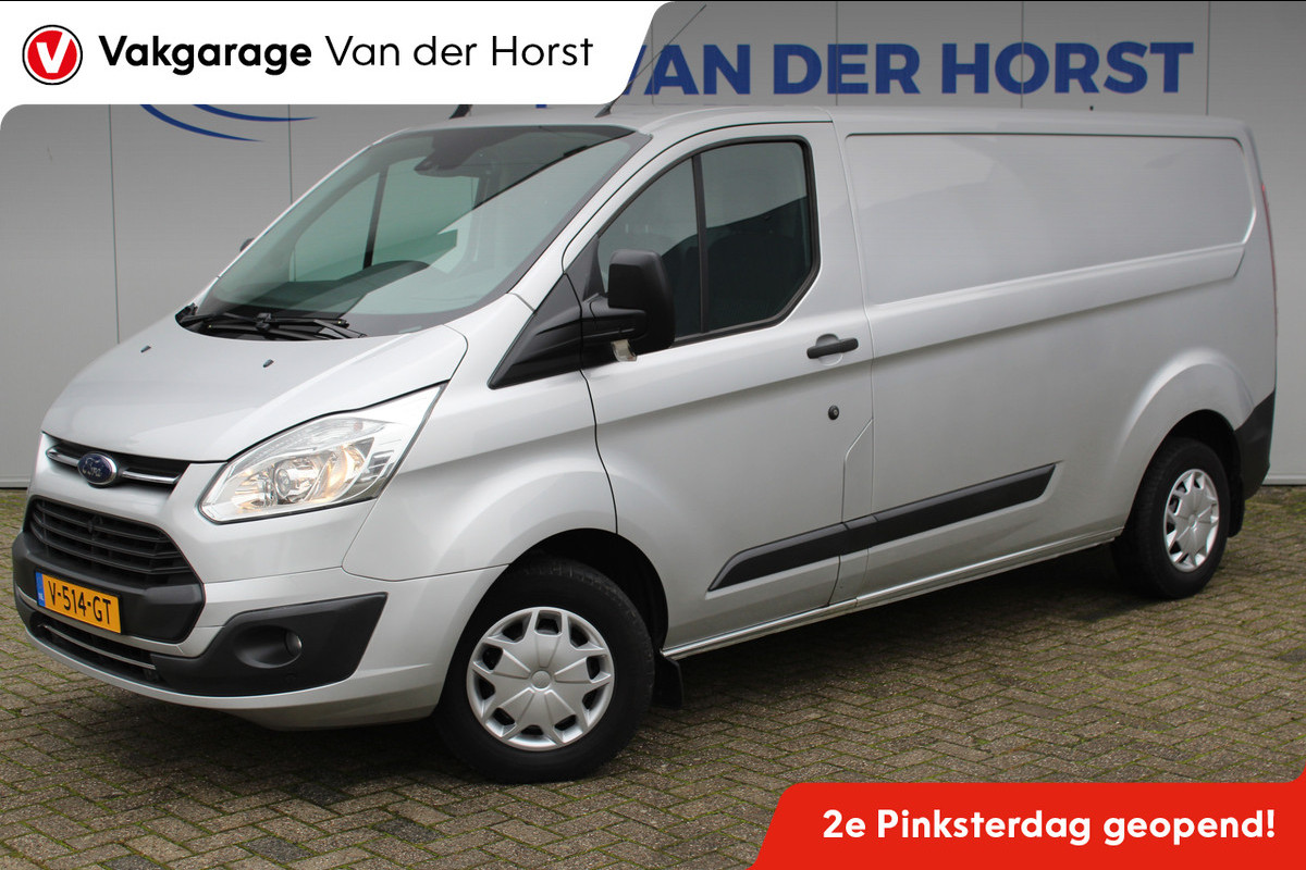Ford Transit Custom 290 2.0-105pk TDCI L2H1 Trend. Nette Ford Custom in de verlengde uitvoering, deze wagen kan u nog jaren tot dienst zijn. Airco, navigatie, telefoonvoorb., voorraamverwarming, lane assist, parkeersensoren v+a, camera, trekhaak, metallic lak, 3-zits etc. Ford Transit Custom 290 2.0-105pk TDCI L2H1 Trend. Nette Ford Custom in de verlengde uitvoering, deze wagen kan u nog jaren tot dienst zijn. Airco, navigatie, telefoonvoorb., voorraamverwarming, lane assist, parkeersensoren v+a, camera, trekhaak, metallic lak, 3-zits etc.