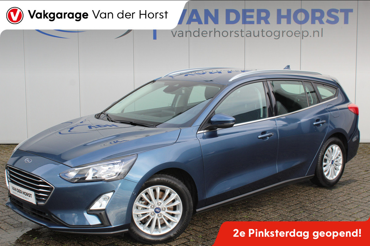 Ford FOCUS Wagon 1.0-125pk EcoBoost Mild-hybrid Titanium. Mooie, ruime, luxe en comfortabele Ford Focus wagon. Volautm. airco dual, camera, stoel-, stuur- en voorraamverw., easy entry/easy go, cruise control, Isofix, side- en lane assist, parkeersensoren v+a, LM wielen etc. Ford FOCUS Wagon 1.0-125pk EcoBoost Mild-hybrid Titanium. Mooie, ruime, luxe en comfortabele Ford Focus wagon. Volautm. airco dual, camera, stoel-, stuur- en voorraamverw., easy entry/easy go, cruise control, Isofix, side- en lane assist, parkeersensoren v+a, LM wielen etc.