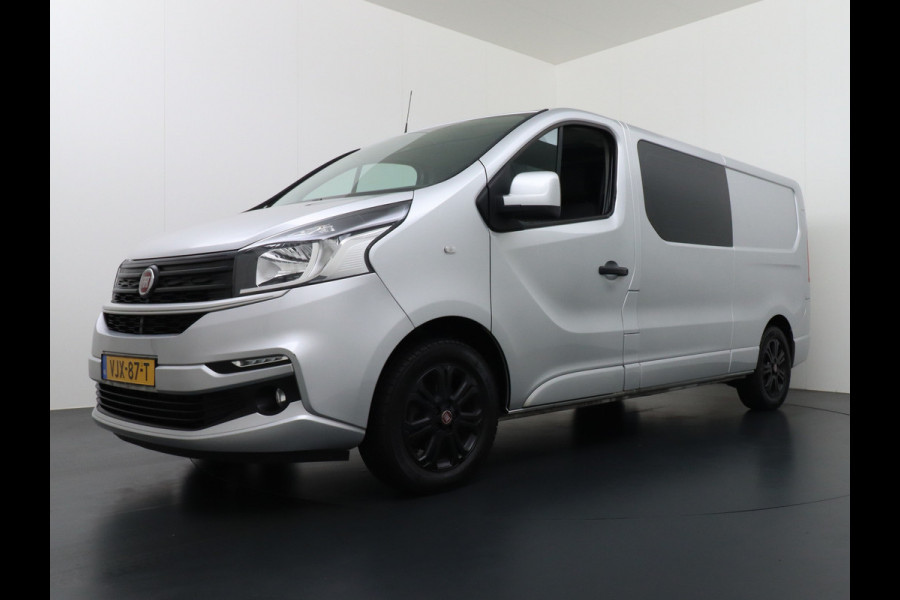 Fiat Talento 2.0D 146PK L2 D.C. 17" Pdc Trekh. Alles in kleur gespoten Led Airco Cruise Business Pro Dubbele Cabine 5-Pers. DC Led Betonplex-vloer Lat om Lat Privacy Glas Bluetooth Lengte 2 dus wél fatsoenlijke beenruimte achterin! 1e Eigenaar 2.000 kg trekvermogen Euro 6