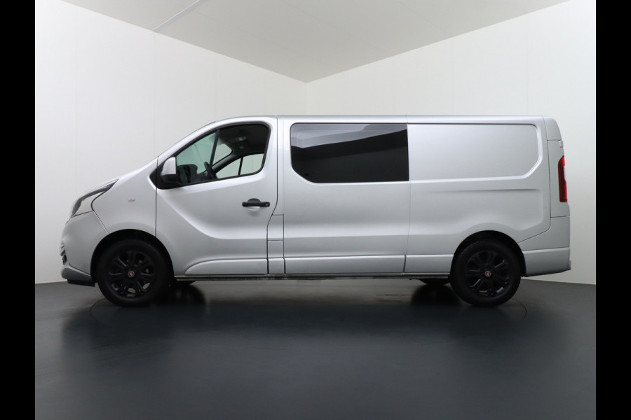 Fiat Talento 2.0D 146PK L2 D.C. 17" Pdc Trekh. Alles in kleur gespoten Led Airco Cruise Business Pro Dubbele Cabine 5-Pers. DC Led Betonplex-vloer Lat om Lat Privacy Glas Bluetooth Lengte 2 dus wél fatsoenlijke beenruimte achterin! 1e Eigenaar 2.000 kg trekvermogen Euro 6