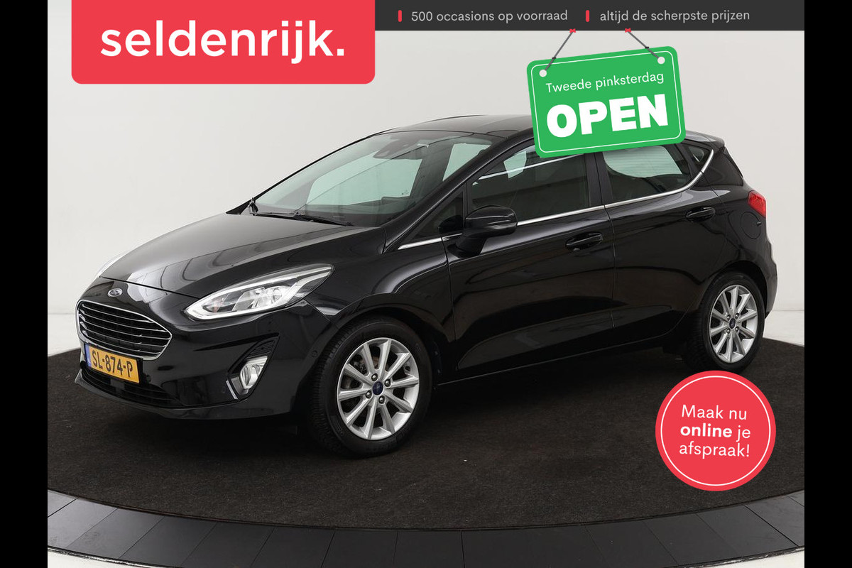 Ford Fiesta 1.0 EcoBoost Titanium | Stoel & stuurverwarming | B&O Sound | Adaptive cruise | Camera | Carplay | Park Assist | Navigatie | Climate control Ford Fiesta 1.0 EcoBoost Titanium | Stoel & stuurverwarming | B&O Sound | Adaptive cruise | Camera | Carplay | Park Assist | Navigatie | Climate control