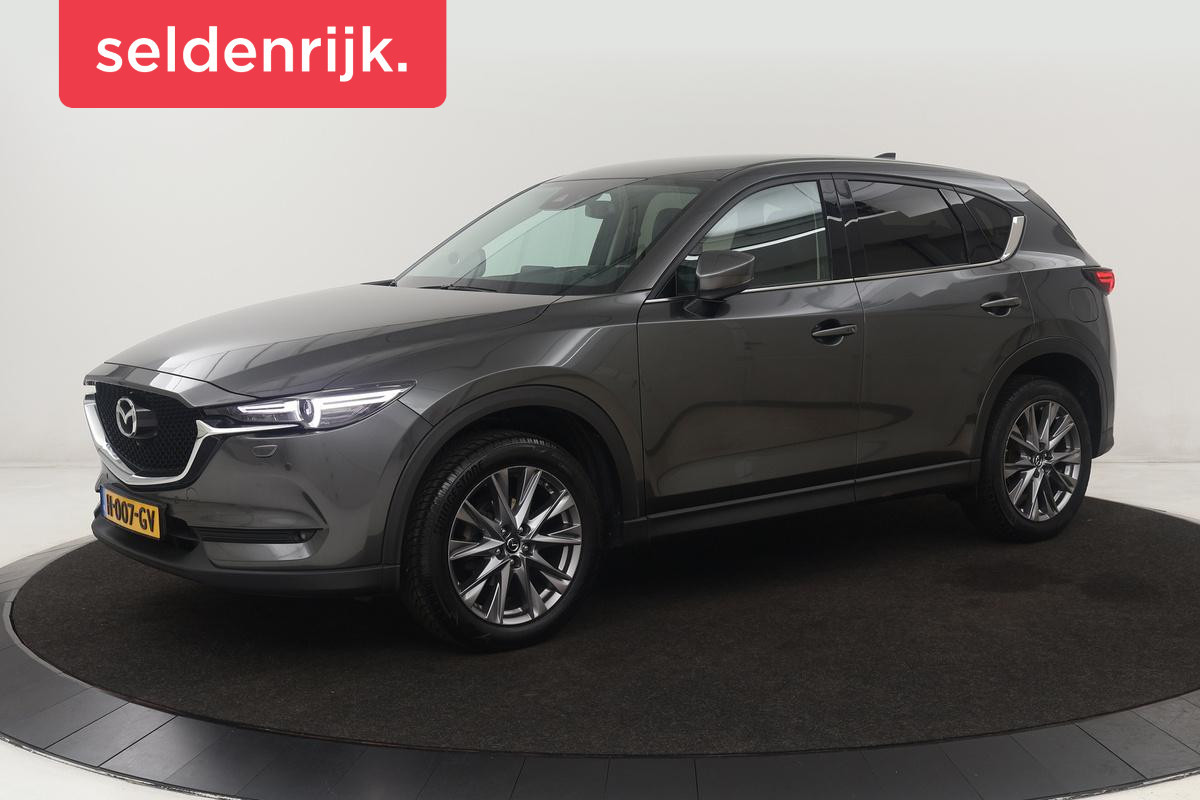 Mazda CX-5 2.0 SkyActiv-G 165 Luxury | Head-Up | Trekhaak | Leder | Stoel & stuurverwarming | 360 camera | Carplay | BOSE Sound | Full LED | Keyless | Memory | Achterbankverwarming Mazda CX-5 2.0 SkyActiv-G 165 Luxury | Head-Up | Trekhaak | Leder | Stoel & stuurverwarming | 360 camera | Carplay | BOSE Sound | Full LED | Keyless | Memory | Achterbankverwarming