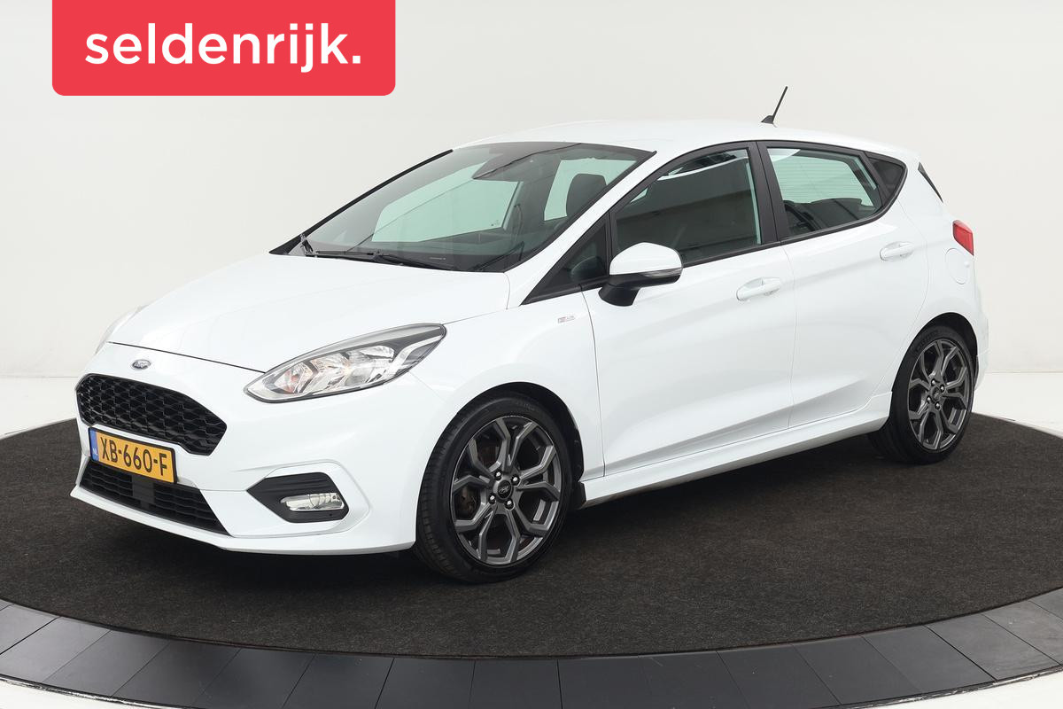 Ford Fiesta 1.0 EcoBoost ST-Line | Stoel & stuurverwarming | Camera | Carplay | Climate control | Sportstoelen | Cruise control | PDC | Bluetooth Ford Fiesta 1.0 EcoBoost ST-Line | Stoel & stuurverwarming | Camera | Carplay | Climate control | Sportstoelen | Cruise control | PDC | Bluetooth