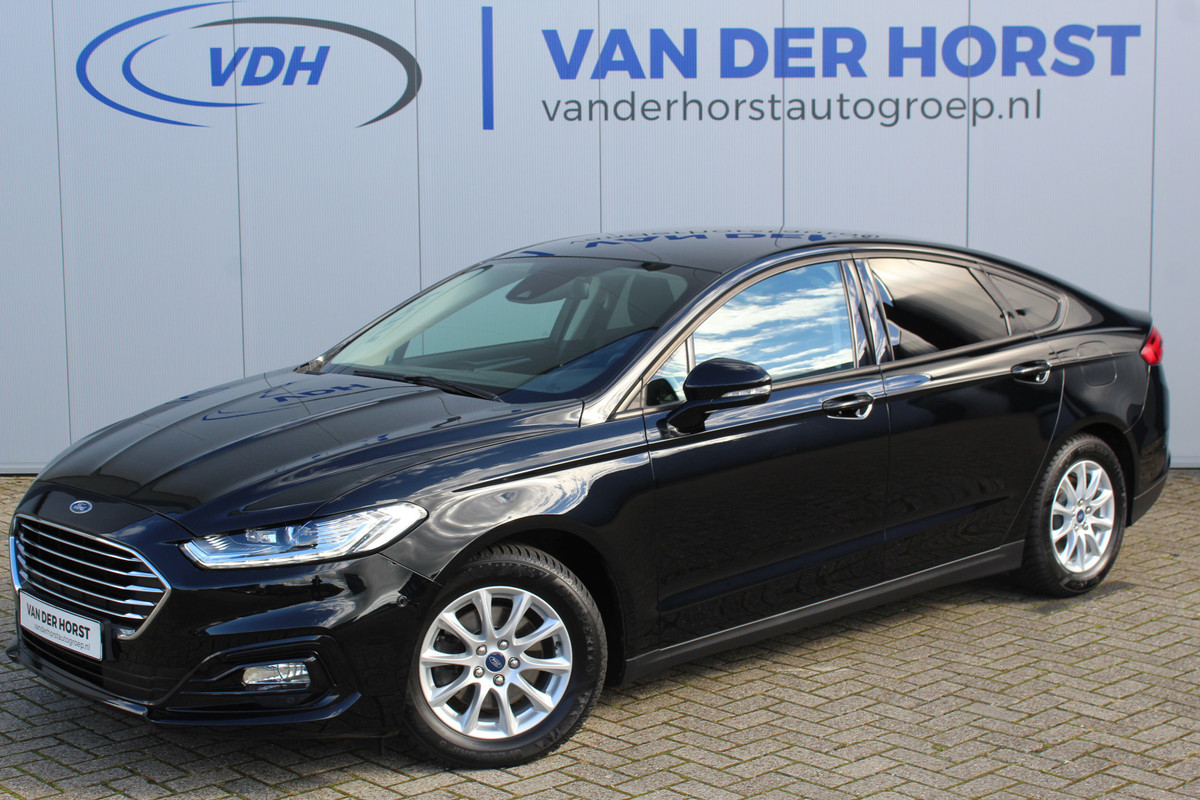Ford Mondeo 1.5-165pk Business Edition. Het is genieten met deze fijne comfortabele Ford Mondeo ! Volautm. airco, navigatie, cruise cntrl, LM wielen, USB, keyless entry/keyless go, stoel- en voorraamverwarmw., parkeersensoren v+a, automatisch grootlicht, LED verl., etc. Ford Mondeo 1.5-165pk Business Edition. Het is genieten met deze fijne comfortabele Ford Mondeo ! Volautm. airco, navigatie, cruise cntrl, LM wielen, USB, keyless entry/keyless go, stoel- en voorraamverwarmw., parkeersensoren v+a, automatisch grootlicht, LED verl., etc.