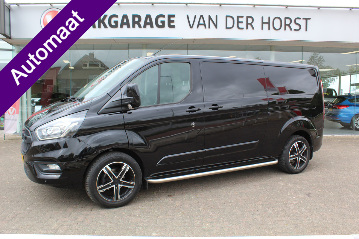 Ford Transit Custom 300 2.0-130pk TDCI L2H1 Limited AUTOMAAT ! Keurige nette en luxe Ford Transit Custom, slechts 47.000km !. Airco, schuifdeur li+re, LM wielen, stoel-, spiegel- en voorraamverw., side en lane assist, 3-zits, navigatie, telefoonvoorb., camera, pdc v+a, cruise cntrl etc. Ford Transit Custom 300 2.0-130pk TDCI L2H1 Limited AUTOMAAT ! Keurige nette en luxe Ford Transit Custom, slechts 47.000km !. Airco, schuifdeur li+re, LM wielen, stoel-, spiegel- en voorraamverw., side en lane assist, 3-zits, navigatie, telefoonvoorb., camera, pdc v+a, cruise cntrl etc.