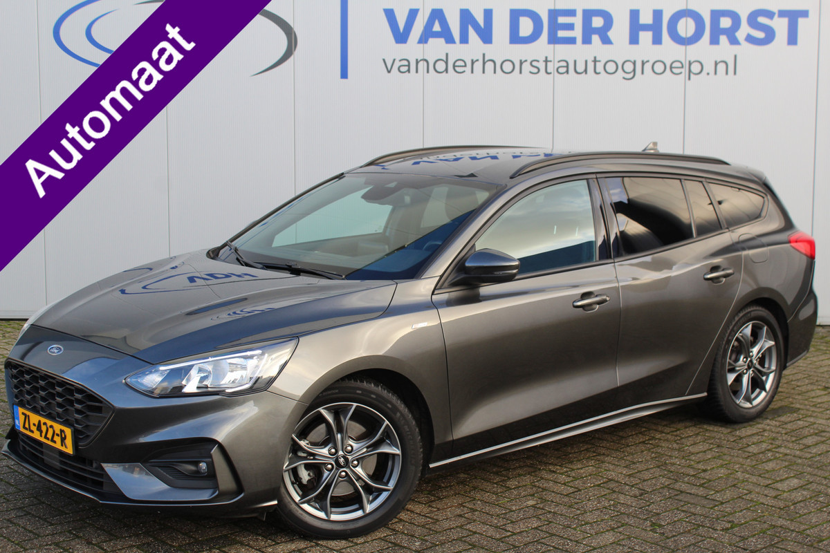 Ford FOCUS Wagon 1.0-125pk EcoBoost ST-Line AUTOMAAT ! Heel erg nette en goed onderhouden Ford Focus ST-Line wagon automaat. Volautm. airco dual, stoel-, stuur- en voorraamverw., camera, trekhaak, navigatie, telefoonvoorb., LM wln, cruise cntrl, skiluik etc., etc.... Ford FOCUS Wagon 1.0-125pk EcoBoost ST-Line AUTOMAAT ! Heel erg nette en goed onderhouden Ford Focus ST-Line wagon automaat. Volautm. airco dual, stoel-, stuur- en voorraamverw., camera, trekhaak, navigatie, telefoonvoorb., LM wln, cruise cntrl, skiluik etc., etc....