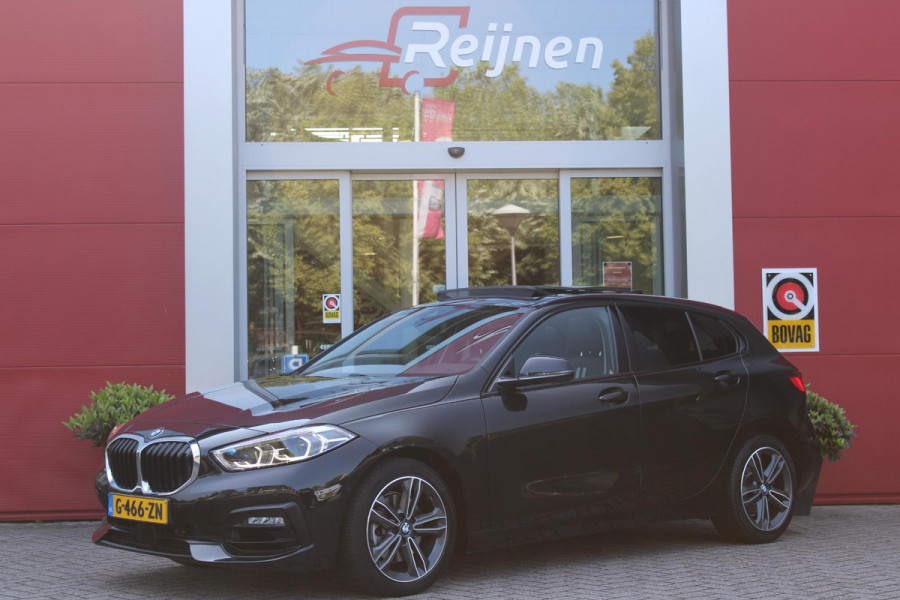 BMW 1-serie 118i 140PK AUTOMAAT EXECUTIVE EDITION | PANORAMISCH SCHUIF/KANTELKDAK | AFNEEMBARE TREKHAAK | DRAADLOZE TELEFOONLADER | DRAADLOZE APPLE CARPLAY/ANDROID AUTO | NAVIGATIE | ACHTERUITRIJ CAMERA | PARKEERSENSOREN VOOR EN ACHTER | CRUISE CONTROL | FULL LED KOPLAMPEN | CLIMATE CONTROL | ALL SEASON BANDEN | 17" LICHTMETALEN VELGEN |