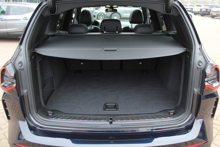 BMW iX3 High Executive 80 kWh / SoH 99% / Trekhaak / Panoramadak / 360Camera / Head-up / 20'' / Leder / Harman Kardon / Sfeerverlichting / Dodehoek / DAB / Stoelverwarming / ACC