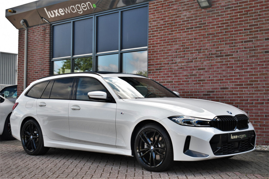 BMW 3 Serie Touring 330e M-Sport Pano ACC El-zetel HUD 19inch Camera Adp-onderstel
