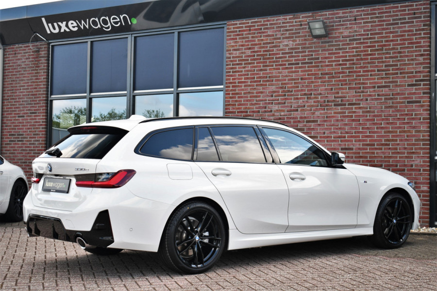 BMW 3 Serie Touring 330e M-Sport Pano ACC El-zetel HUD 19inch Camera Adp-onderstel