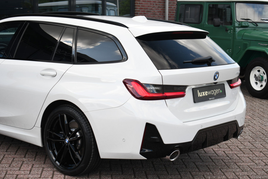 BMW 3 Serie Touring 330e M-Sport Pano ACC El-zetel HUD 19inch Camera Adp-onderstel
