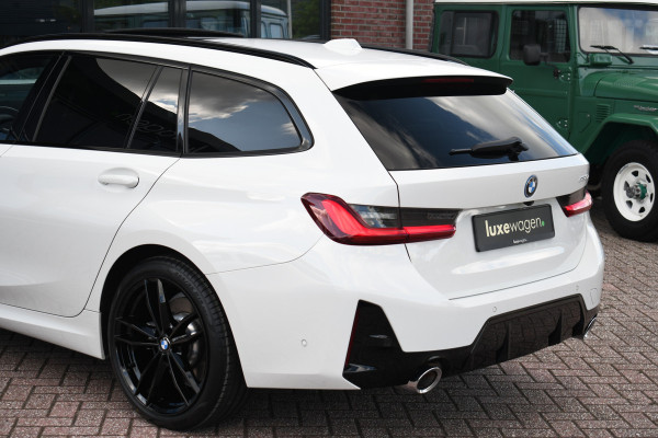 BMW 3 Serie Touring 330e M-Sport Pano ACC El-zetel HUD 19inch Camera Adp-onderstel