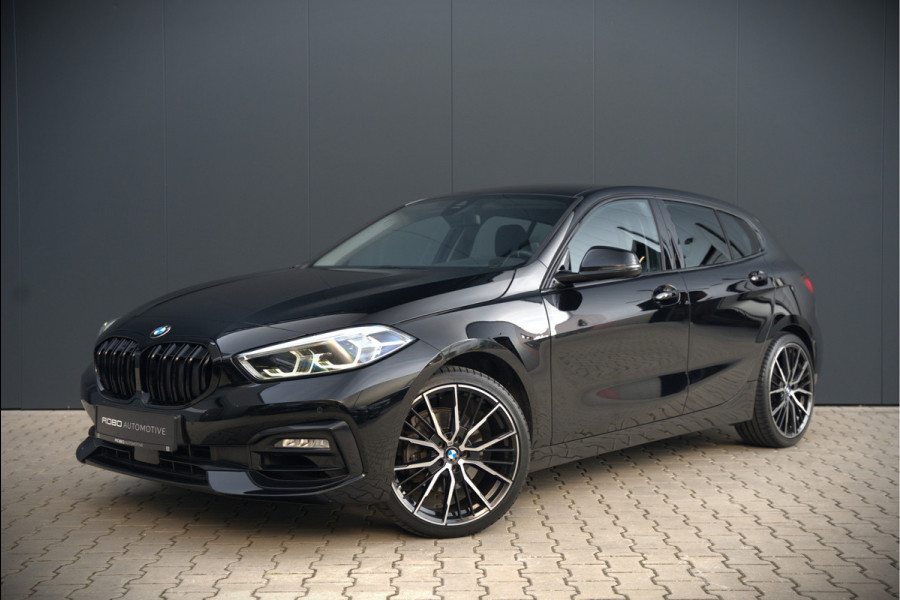 BMW 1-serie 118i High Executive Edition | Virtual Dash | Apple Carplay | Stoelverwarming | Leer | Led | Keyless | PDC | Shadow Line | Automaat | M Sport Stuur | Climate Control | Cruise Control |