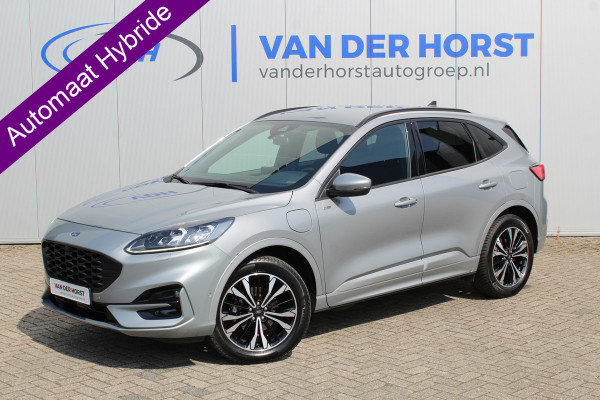 Ford Kuga 2.5-225pk PHEV ST-Line X. Hybride rijden voor een redelijke prijs ! Volautm. airco dual, Metallic lak, Stuur-, stoel-, achterbank- en voorraamverwarming, Side-en lane assist, Camera, pdc v+a, Adaptive Cruise Control, Elektr. achterklep etc, etc.