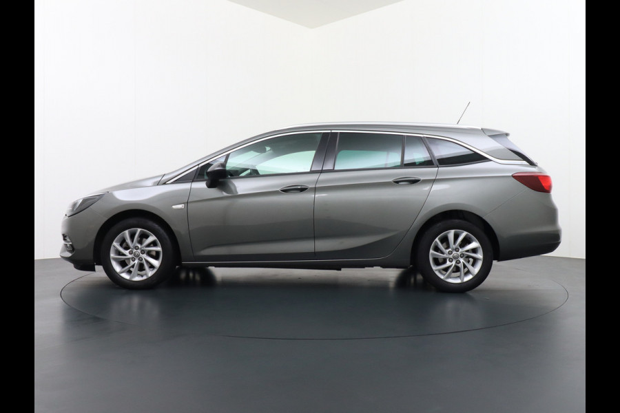 Opel Astra Sports Tourer T 111pk Navi Apple/Android Elek.klep Keyless Lane-dep. CruiseControl Pdc-a+v Ecc Licht-/Zichtpakket Bluetooth Isofix 4xElek.Ramen Mistlampen Usb 16''LM Dealer Onderhouden 1.2 Turbo Business Elegance