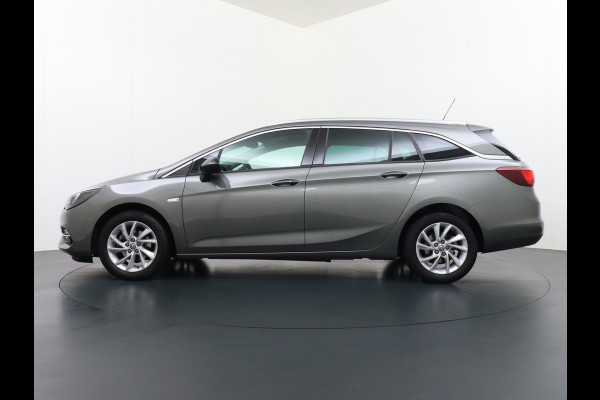 Opel Astra Sports Tourer T 111pk Navi Apple/Android Elek.klep Keyless Lane-dep. CruiseControl Pdc-a+v Ecc Licht-/Zichtpakket Bluetooth Isofix 4xElek.Ramen Mistlampen Usb 16''LM Dealer Onderhouden 1.2 Turbo Business Elegance