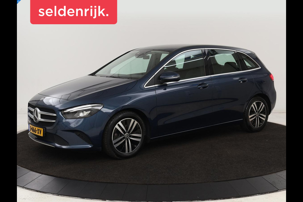 Mercedes-Benz B-Klasse 180 Business Solution Luxury | Leder | Trekhaak | Stoelverwarming | Camera | Navigatie | Full LED | Park Assist | Sfeerverlichting | Widescreen Mercedes-Benz B-Klasse 180 Business Solution Luxury | Leder | Trekhaak | Stoelverwarming | Camera | Navigatie | Full LED | Park Assist | Sfeerverlichting | Widescreen