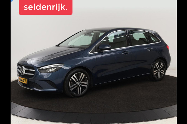 Mercedes-Benz B-Klasse 180 Business Solution Luxury | Leder | Trekhaak | Stoelverwarming | Camera | Navigatie | Full LED | Park Assist | Sfeerverlichting | Widescreen