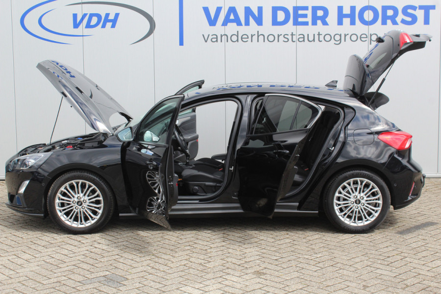 Ford Focus 1.0-125pk EcoBoost Titanium. Erg nette, luxe en goed onderhouden Ford Focus. Volautm. airco dual, stoel-, stuur- en voorraamverw., trekhaak, Xenon verl., LM wielen, navigatie, telefoonvoorb., adaptieve cruise cntrl,  keyless entry/keyless go etc, etc.
