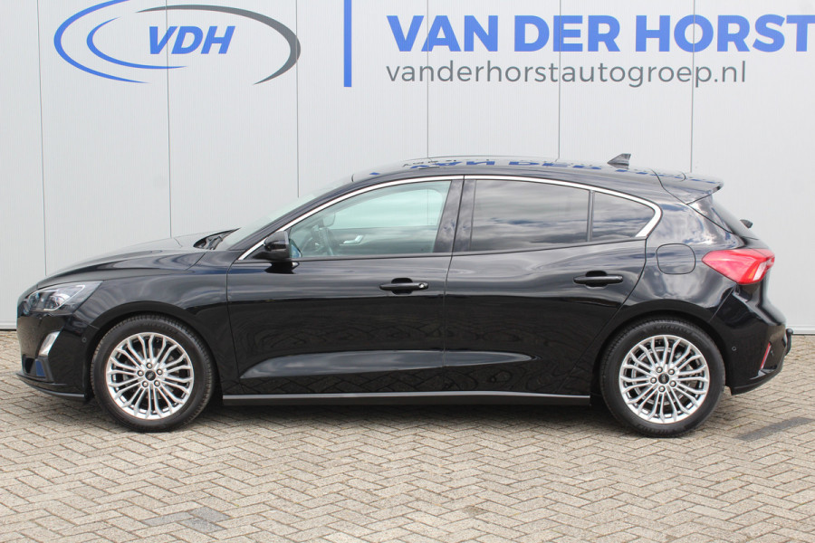 Ford Focus 1.0-125pk EcoBoost Titanium. Erg nette, luxe en goed onderhouden Ford Focus. Volautm. airco dual, stoel-, stuur- en voorraamverw., trekhaak, Xenon verl., LM wielen, navigatie, telefoonvoorb., adaptieve cruise cntrl,  keyless entry/keyless go etc, etc.